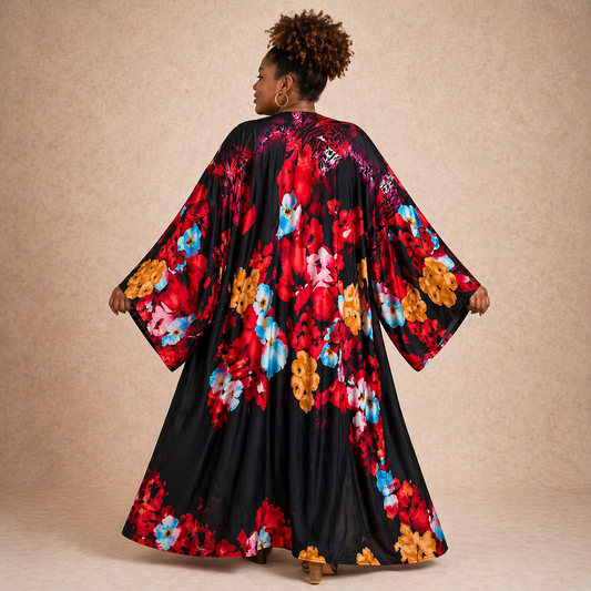 Woman wearing a colorful floral kimono against a beige background