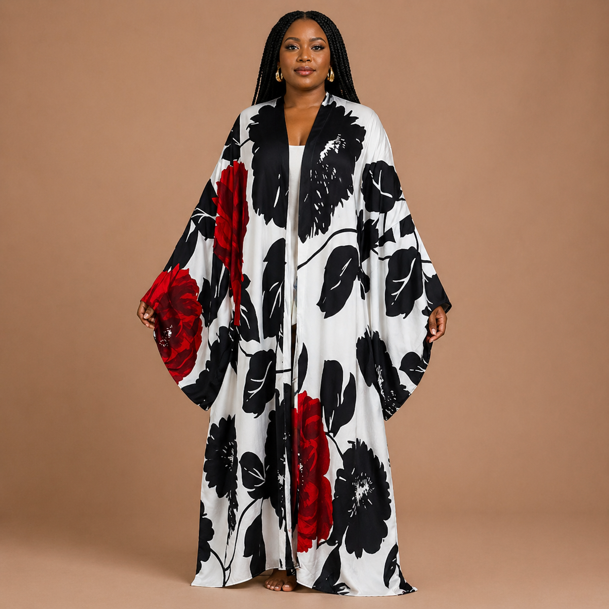 Woman wearing a floral kimono with red and black flowers on a beige background