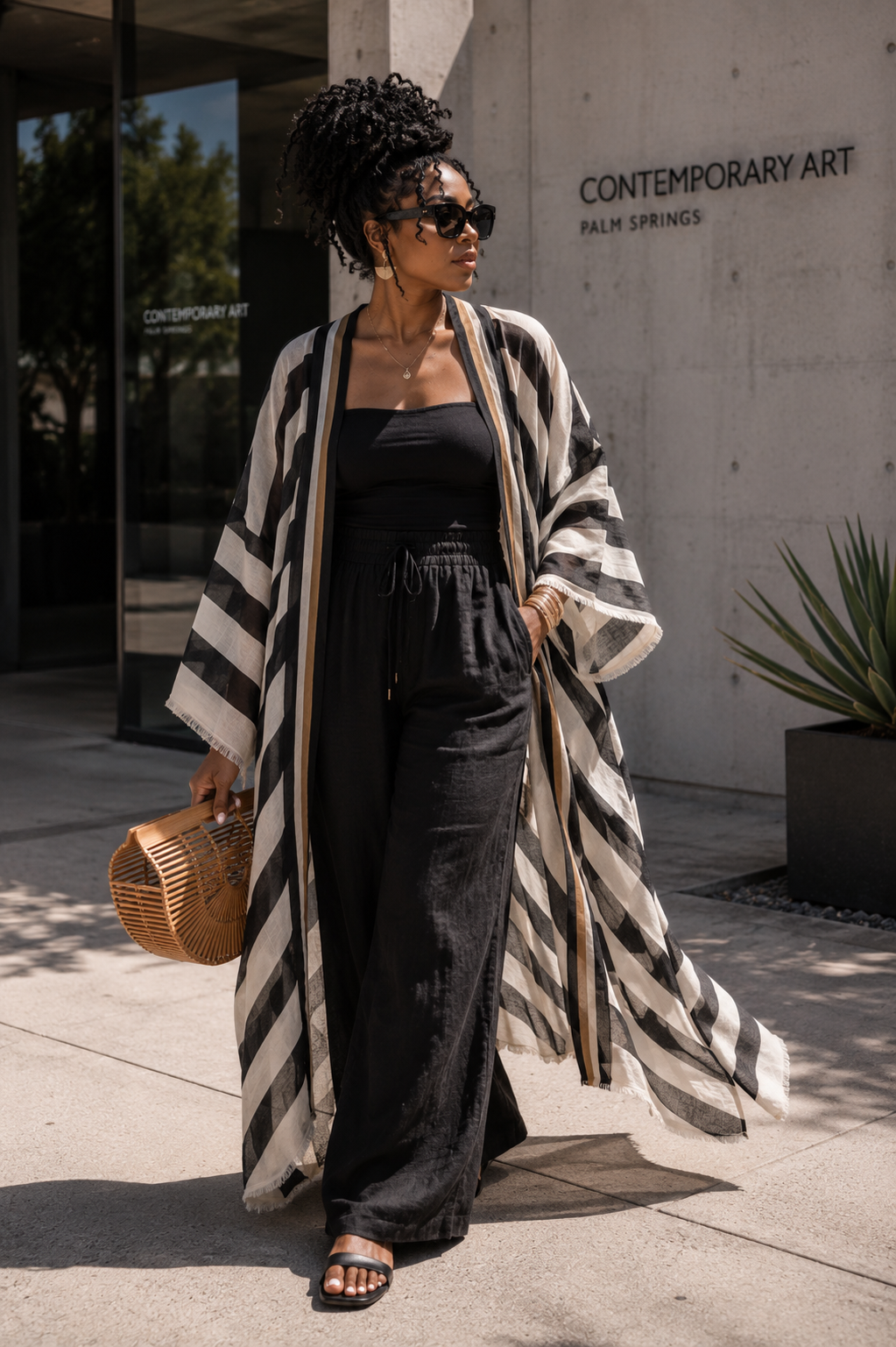 Woman wearing a black and white striped kimono (Black)