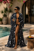 Woman in a black and white patterned robe by a poolside