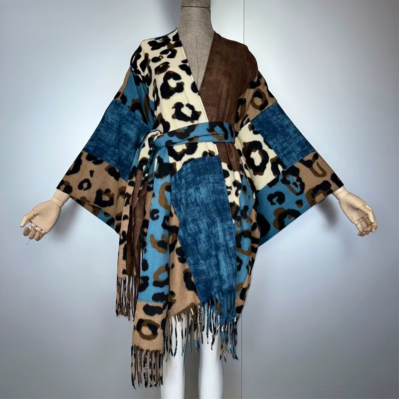 Mannequin wearing a leopard print and denim patterned poncho on a plain background (Blue)