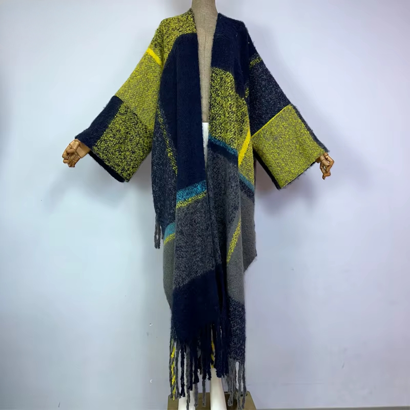 Colorful patterned coat with fringes on a mannequin against a white background (Blue)