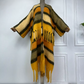 A wool cardigan kimono with striped patterns and fringes displayed on a mannequin against a white background. (Orange)