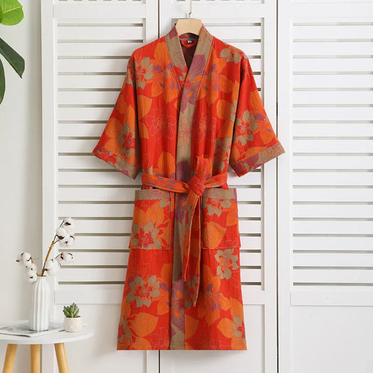 Orange floral kimono hanging on a white wooden panel background (Red)