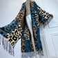 Leopard print scarf with blue accents draped over a mannequin against a white background (Blue)
