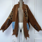 Brown knitted cardigan with leopard print and denim patches on a mannequin against a white wall. (Brown)