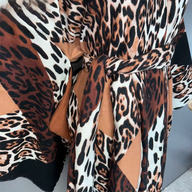 Leopard print fabric with a tie detail on a plain background (Brown)