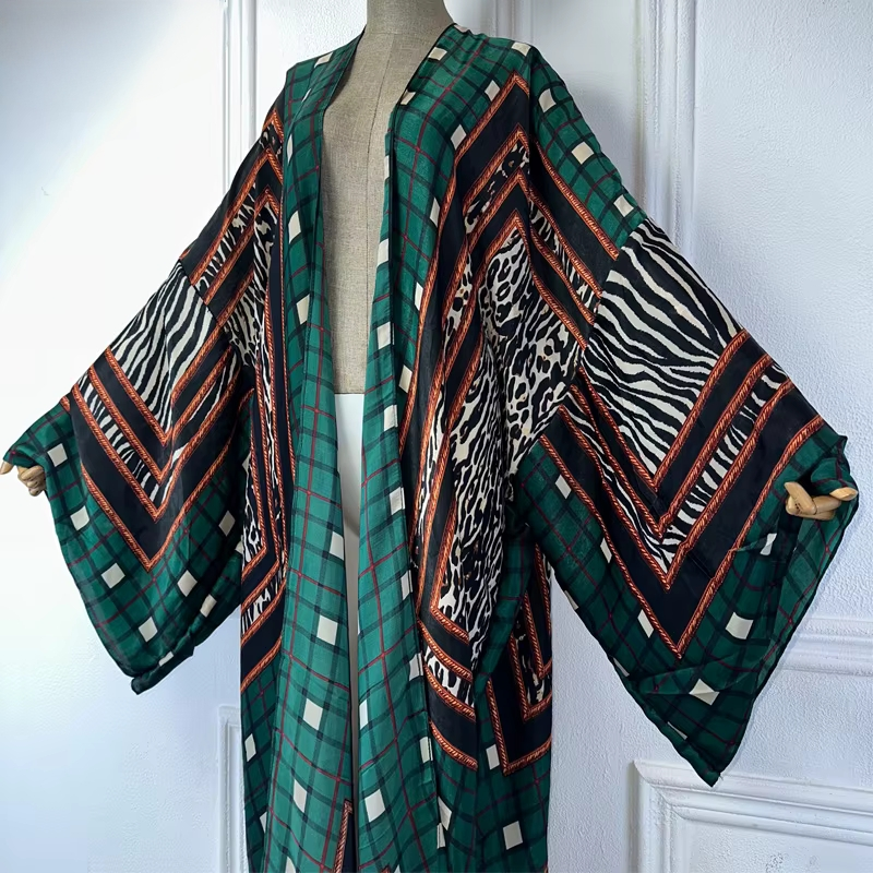 Mannequin wearing a green patterned kimono against a white wall (Green)