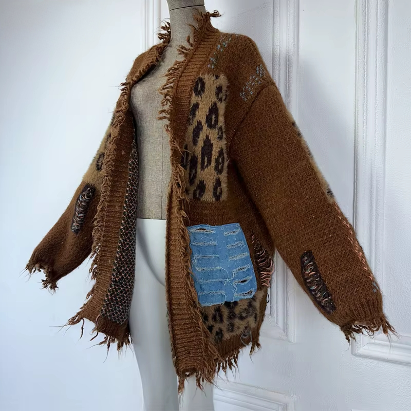 Brown textured sweater with leopard print and blue pocket on a mannequin against a white wall. (Brown)