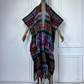 A plaid wool hooded kimono with fringes displayed on a mannequin. (Blue) 