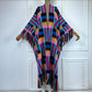 Colorful crocheted poncho on a mannequin against a white background  (Pink)