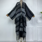 A wool cardigan kimono with striped patterns and fringes displayed on a mannequin against a white background. (Grey)