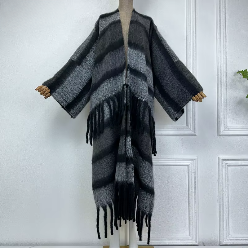 A wool cardigan kimono with striped patterns and fringes displayed on a mannequin against a white background. (Grey)