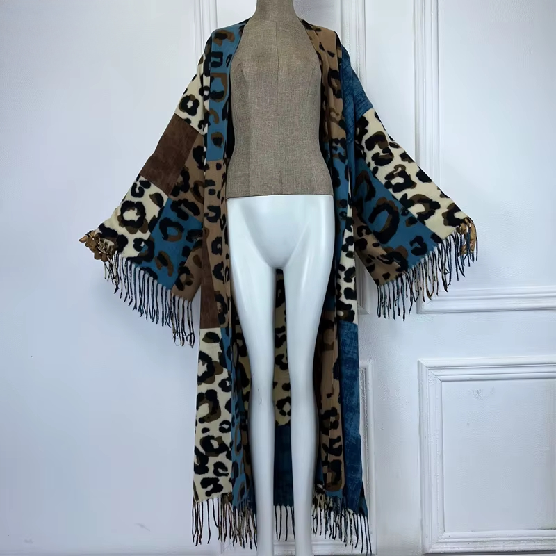 Mannequin wearing a leopard print kimono with fringes against a white background (Blue)