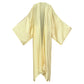 A beige, solid-colored kimono laid out on a plain background, showcasing its flowing design. (Cream)