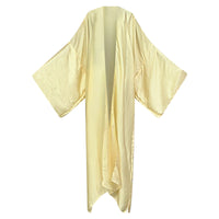 A beige, solid-colored kimono laid out on a plain background, showcasing its flowing design. (Cream)