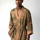 Man wearing a green and brown patterned robe on a white background (Green)