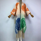A wool kimono with a paisley pattern in multicolor displayed on a mannequin. (Orange)