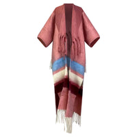 Red poncho with colorful stripes and fringes on a white background (Pink)
