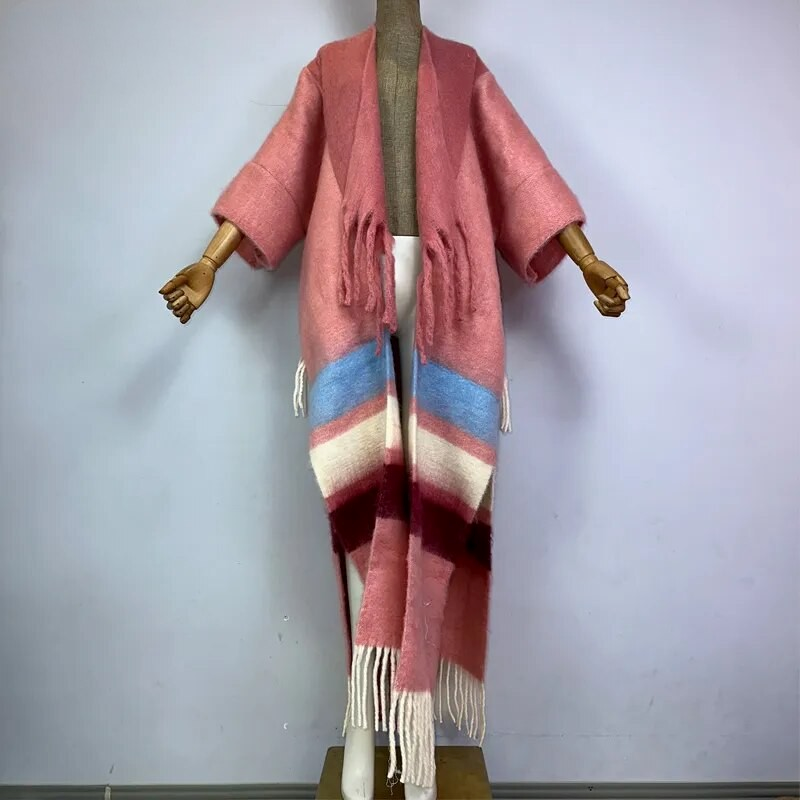 A wool kimono with a colorful striped pattern and tassel detailing displayed on a mannequin. (Pink)