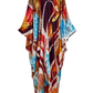 A long, flowing kaftan dress featuring a vibrant, abstract animal-inspired print with red, orange, blue, brown, and cream elements, displayed on a clean white background.