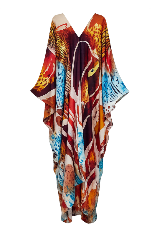 A long, flowing kaftan dress featuring a vibrant, abstract animal-inspired print with red, orange, blue, brown, and cream elements, displayed on a clean white background.
